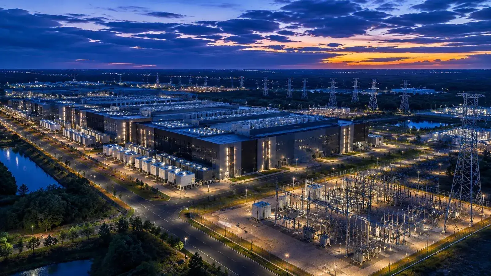 Hyperscale data center campus with substation at dusk